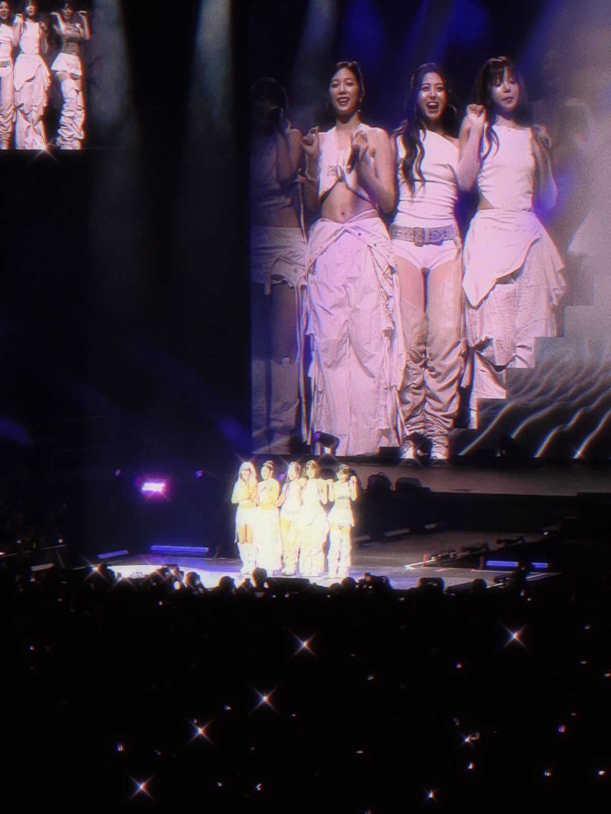 LE SSERAFIM performing at EASY CRAZY HOT, Sep 2025, the group in white with a close-up on the big screen